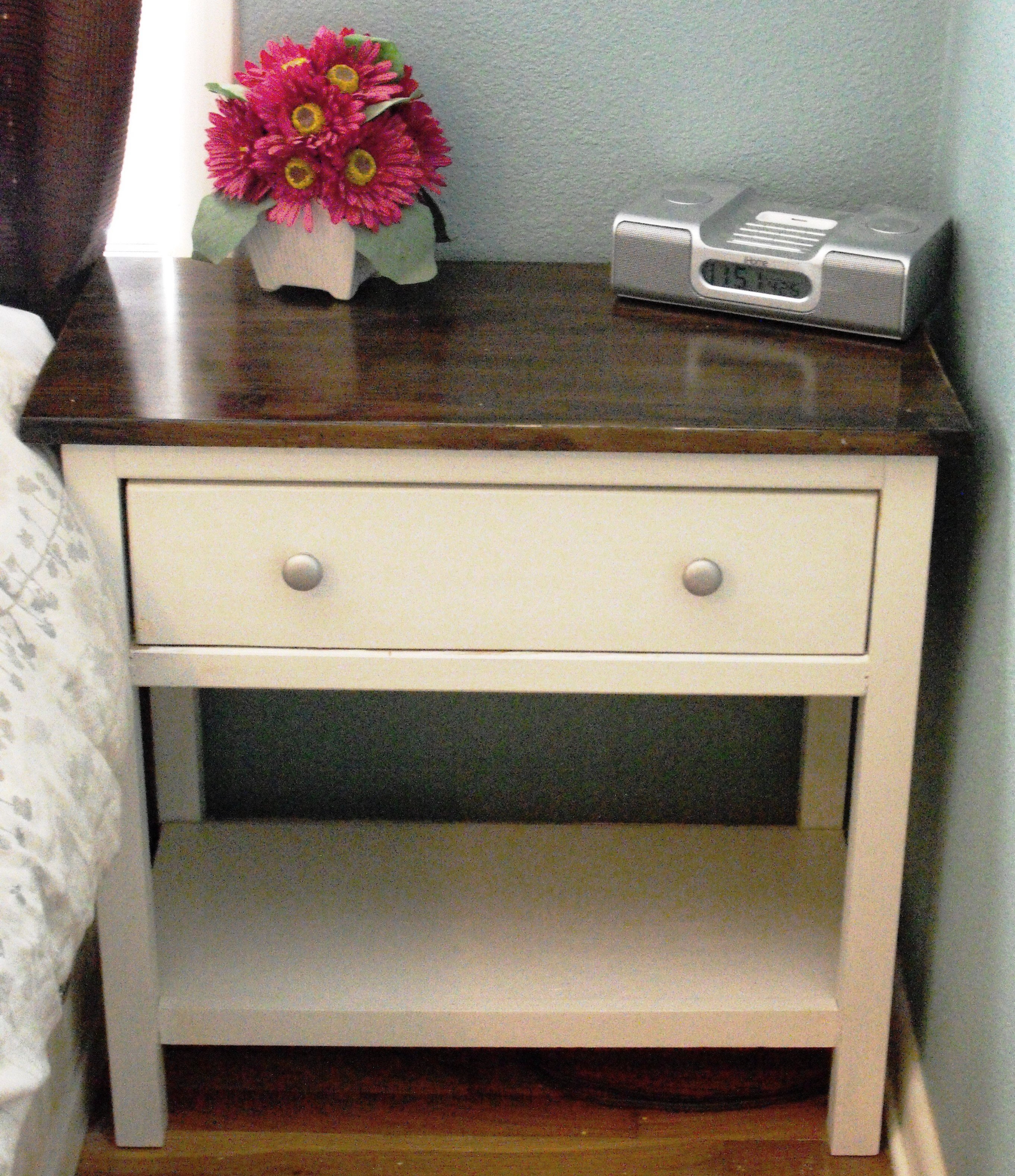 The purpose of the bedside table in the bedroom