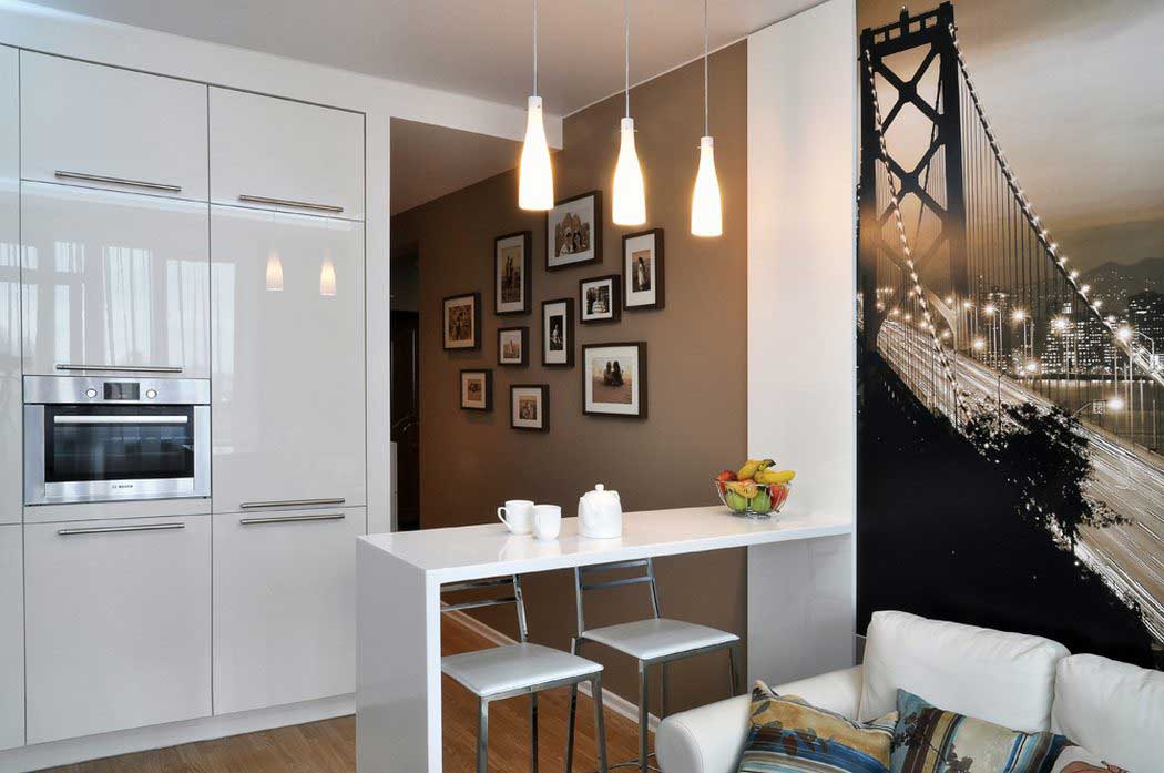 Small kitchen-living room with bright and unusual decor on the walls