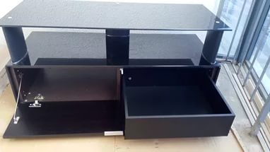 Porta TV scuro con cassetto