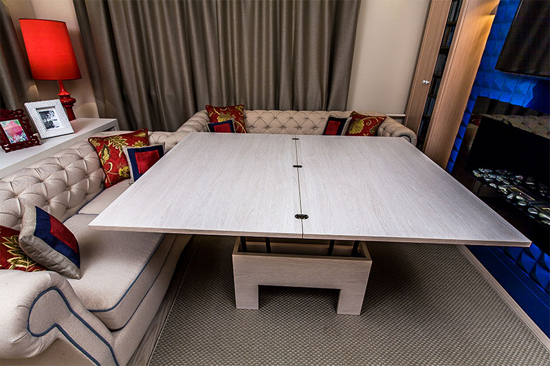 Cozy living room with a transformer table and soft carpet