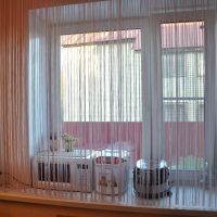 bright curtains of thread in the interior of the corridor picture