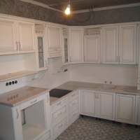 bright interior of a white kitchen with a shade of gray picture