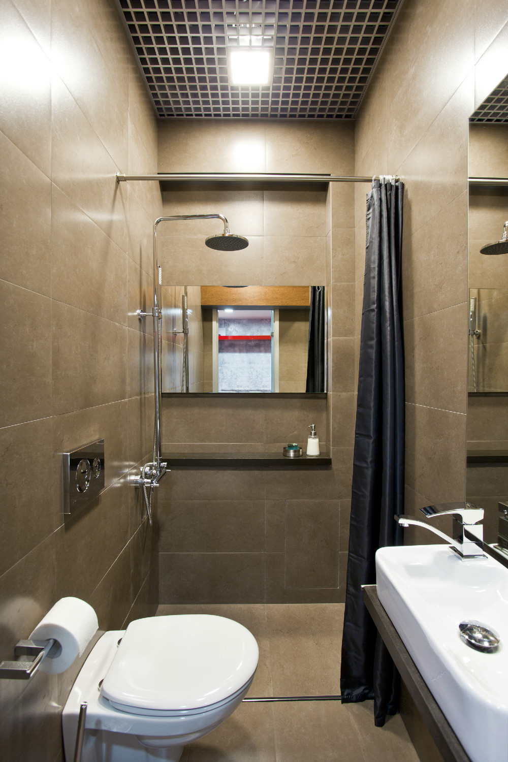 brightly decorated bathroom with bright showers