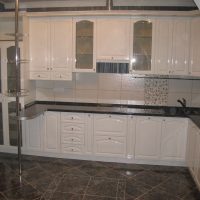 bright interior of a white kitchen with a touch of beige photo