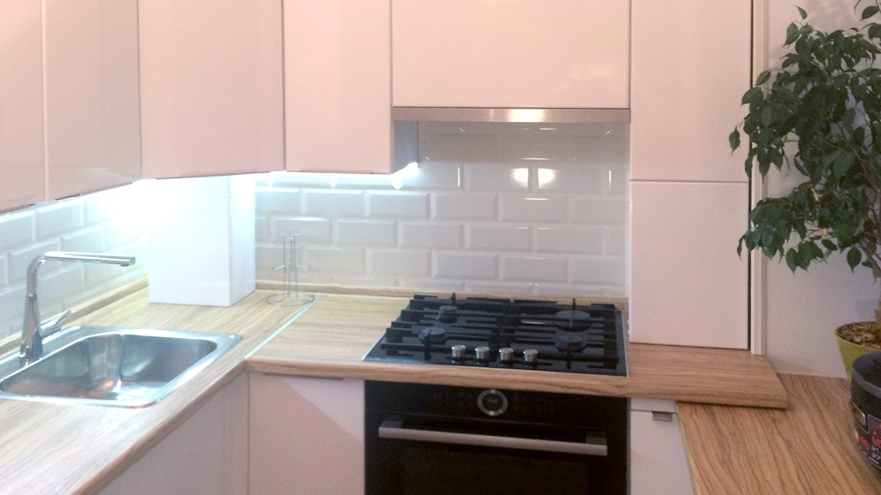 beautiful design of a white kitchen with a touch of beige