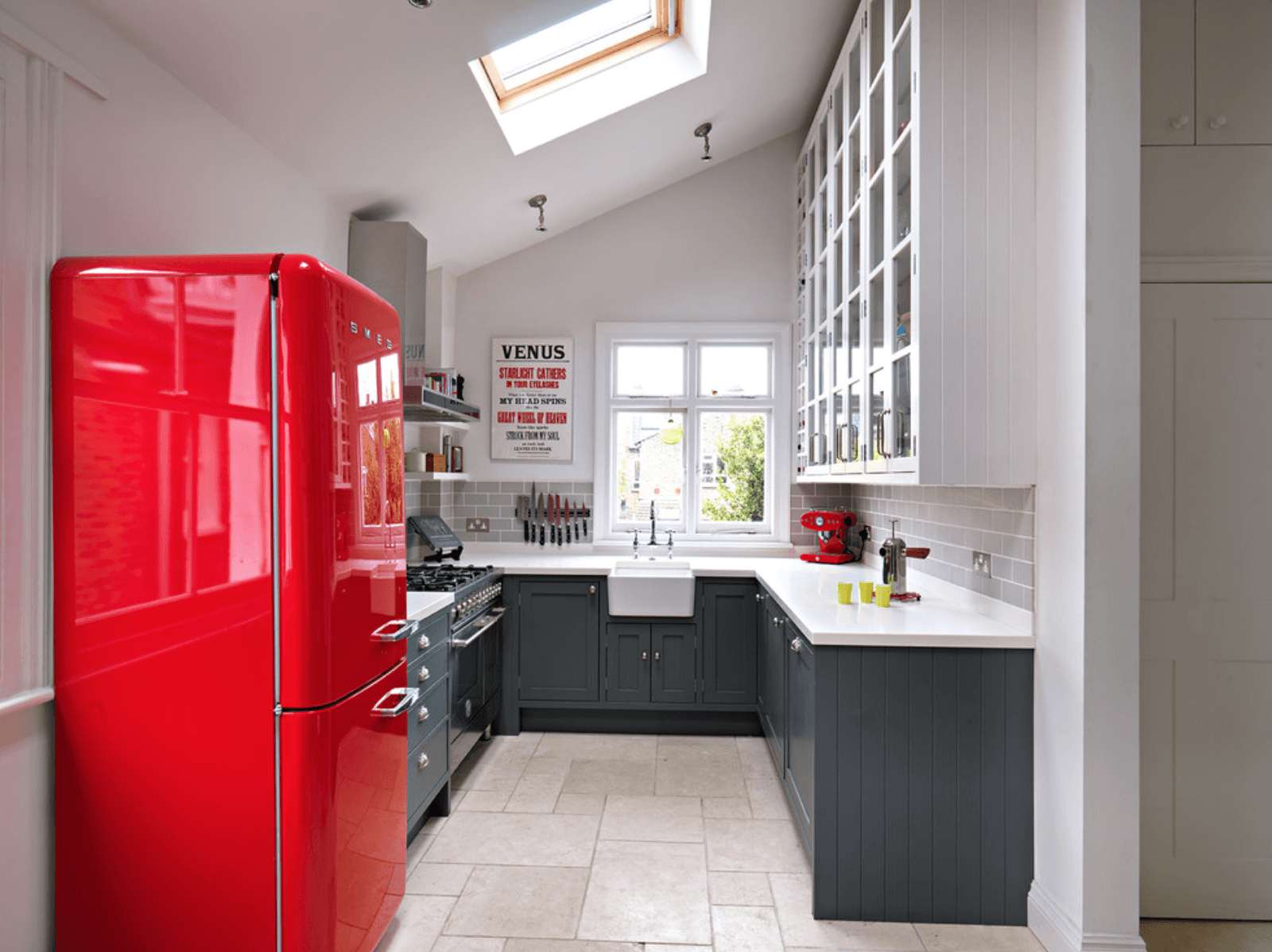 small refrigerator in the decor of the kitchen in dark color