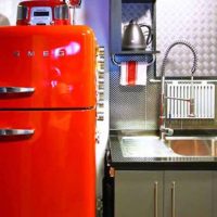 a small refrigerator in the interior of the kitchen in multi-colored color picture