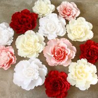 red paper flowers in the facade of the festive hall photo