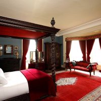 saturated burgundy color in the decor of the bedroom photo