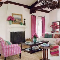 a combination of bright pink in the design of the living room with other colors of the photo