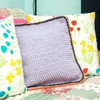 crocheted pillowcases in the decor of the room photo