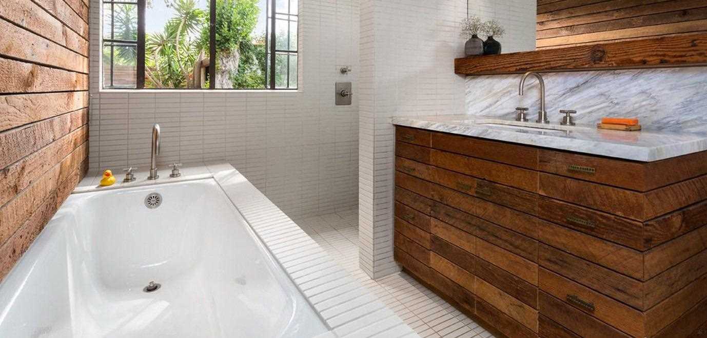 version of the modern design of the bathroom in a wooden house