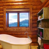 variant of the unusual interior of the bathroom in a wooden house photo