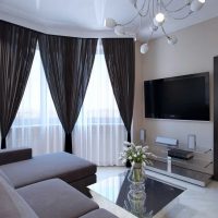 example of an unusual interior of a living room with a bay window photo