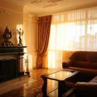 example of an unusual decor of a living room with a fireplace photo