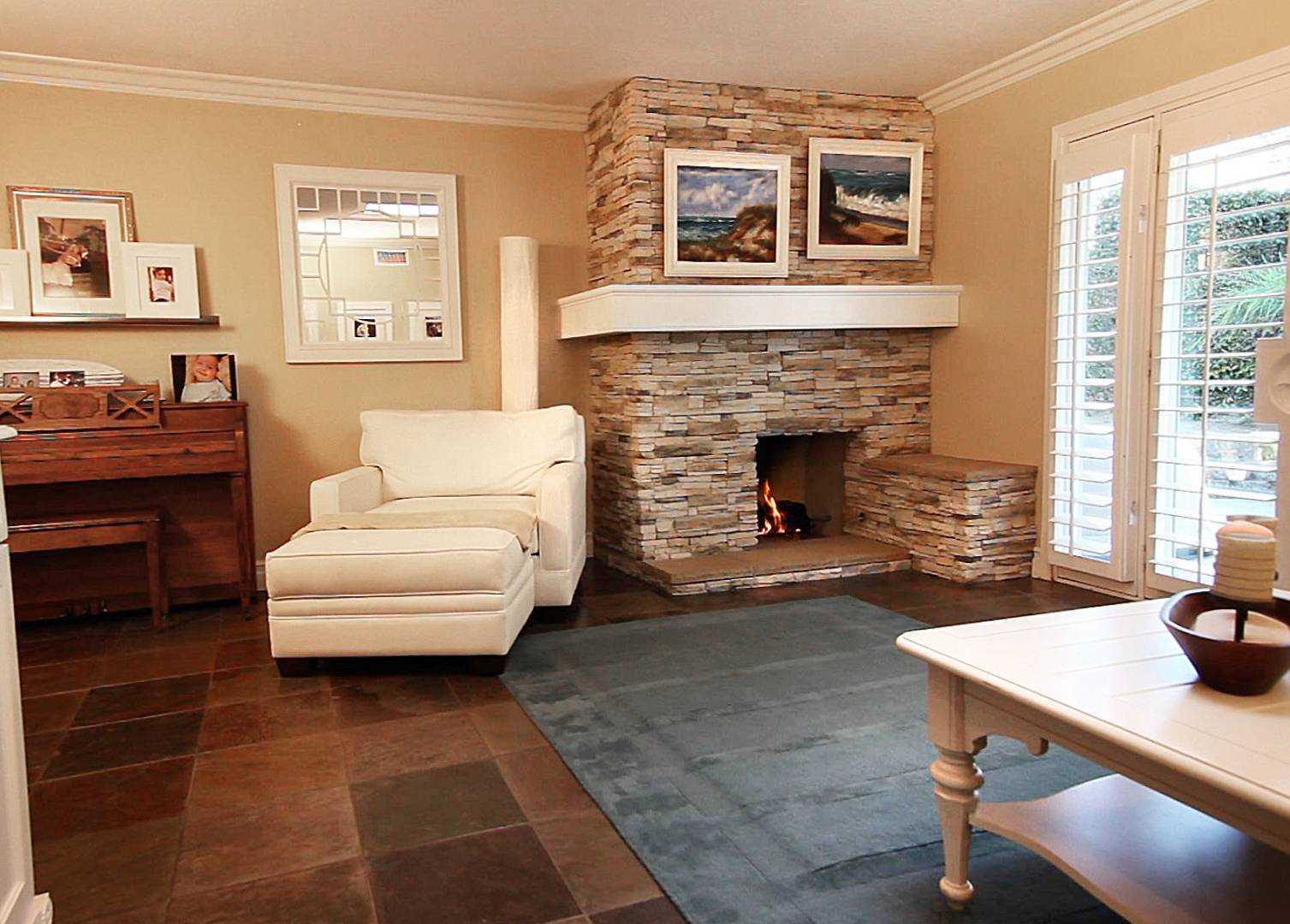 An example of an unusual design of a living room with a fireplace