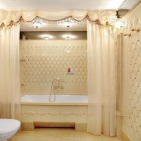 variant of the unusual interior of the bathroom in beige color photo