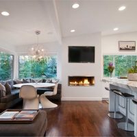 An example of a bright interior of a living room with a fireplace photo