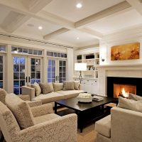 An example of a bright living room interior with a fireplace photo