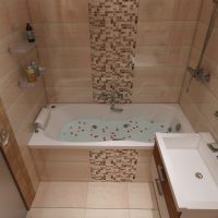 An example of a bright bathroom interior in beige color photo