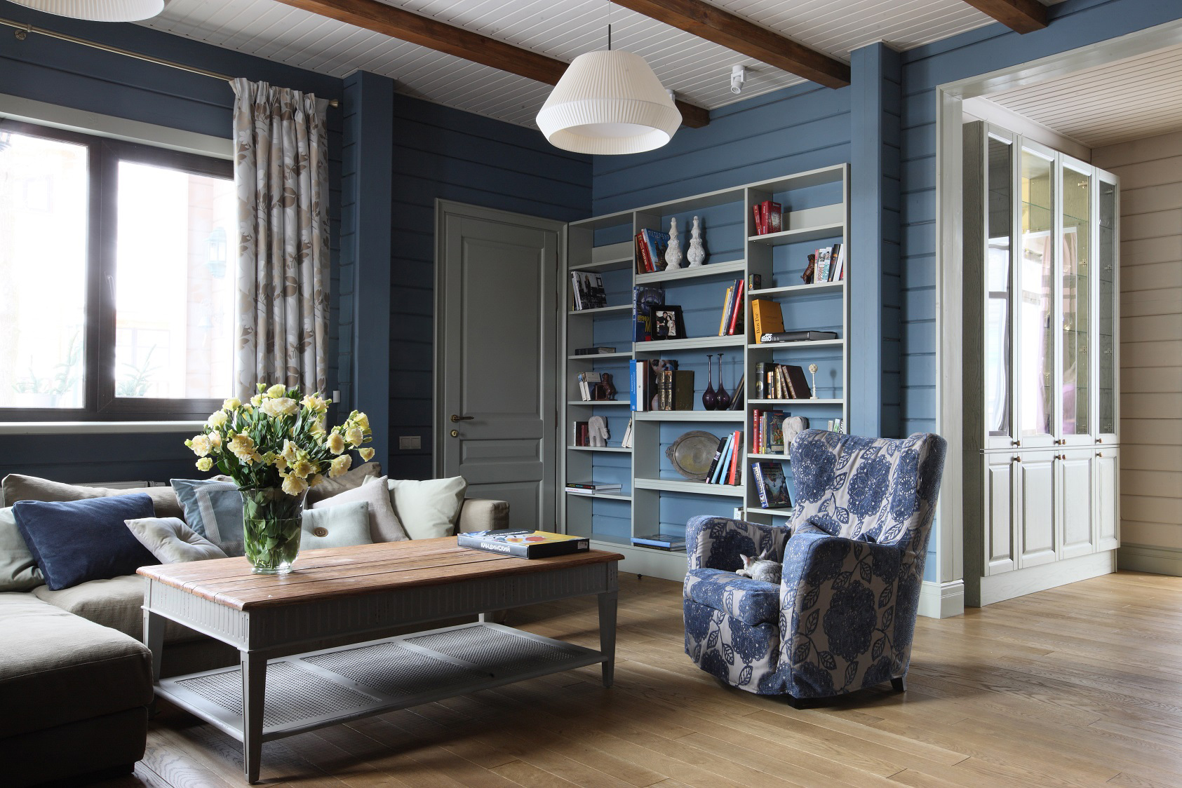 living room cabinet with gray wallpaper