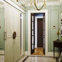 an example of a light style hallway with photo mirrors