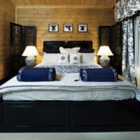 bedroom in a wooden house cold colors