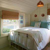 bedroom in a wooden house in white