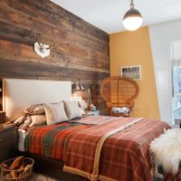 bedroom in a wooden house with natural wood