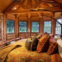 bedroom in a wooden house decor textiles