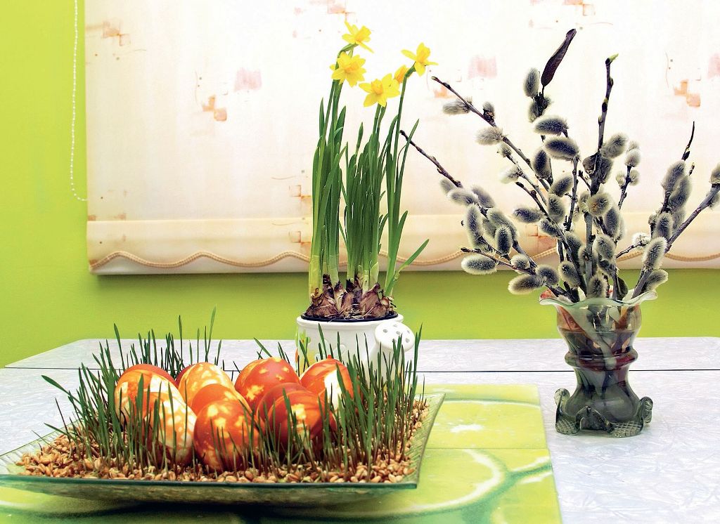 Festive table decoration for Easter greens and flowers