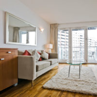 Large mirror above the sofa in the living room