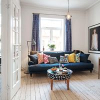 Original coffee table and homemade pillows on the sofa