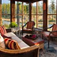 Rattan, stone and wood in the design of the summer terrace