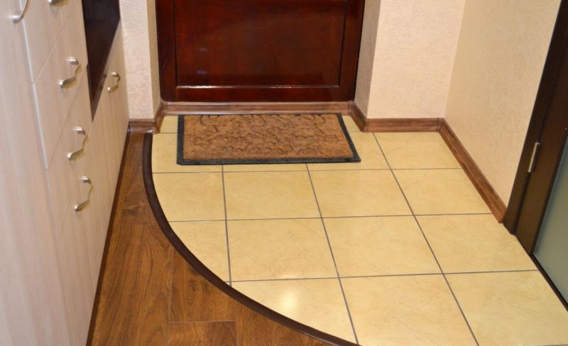 Ceramic tiles in the hallway and rug