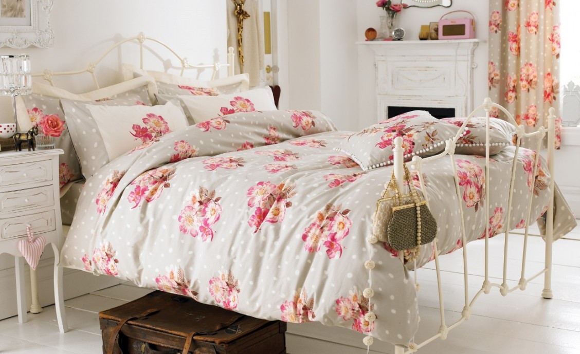 Bed in Provence-style country house bedroom