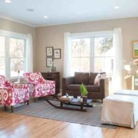 Two windows in the living room with simple curtains