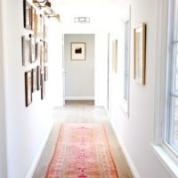 A long walkway on the floor of a brightly lit hallway