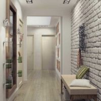 White entrance hall with decorative stone wall decoration