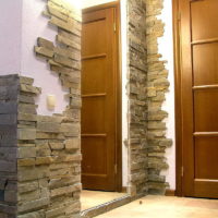 Tiles of stone in the edging of the doorway in the hallway