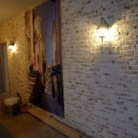 Imitation of masonry on the wall in the hallway