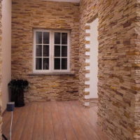 Hallway of a private house with stone wall decoration