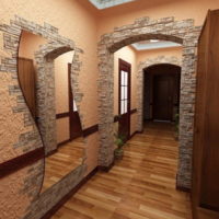 The combination of stone and textured plaster on the wall in the hallway