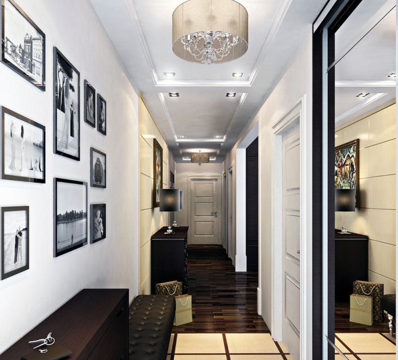 Elongated entrance hall with a large mirror on the cabinet door