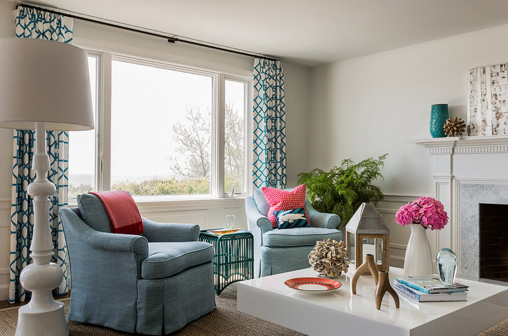 Living room with a wide window and straight curtains