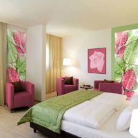 Green and pink shades in the bedroom with photo wallpaper