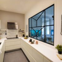 Beads on a white wall in the interior of the kitchen