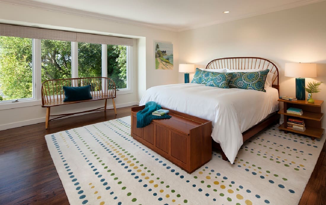 Minimalist bedroom design with wooden bed.