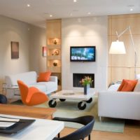 Accents of orange in the design of the room