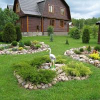 Stone beds in the middle of the front lawn